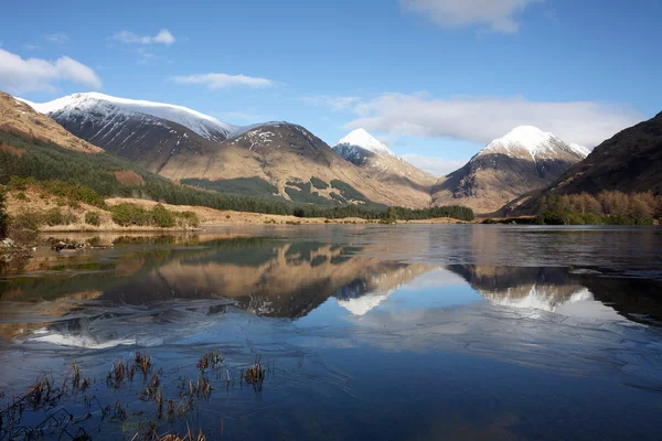 Snow capped mountains in the Highlands of Scotland. by John Cameron - Stock