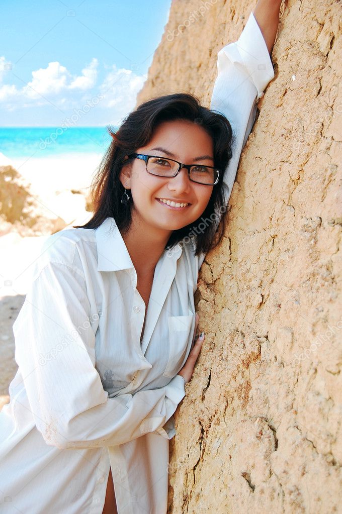 A young girl on the tropical beach