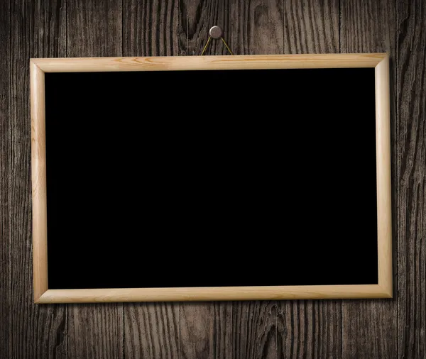 Vintage picture frame on wooden wall, clipping path.