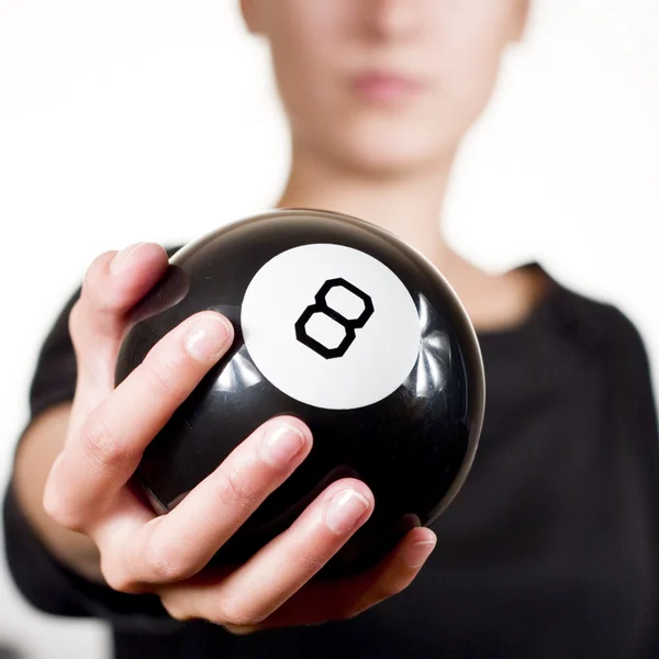 Woman holding black 8 ball