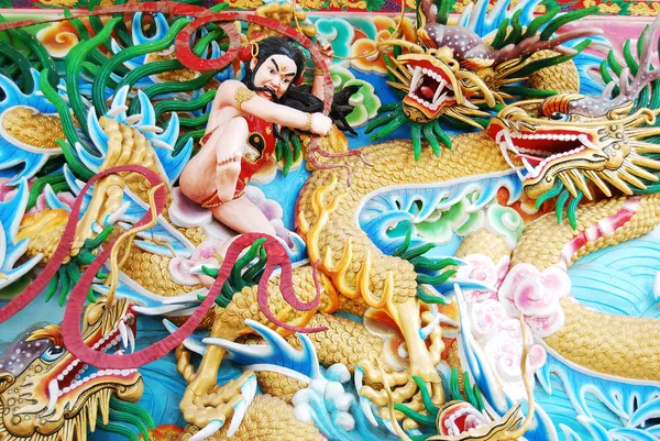 Chinese God Fighting with Dragon Sculpture Painting on wall.