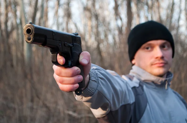 stock image Man aiming gun