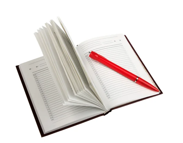 Journal ouvert vide et stylo bille rouge — Photo