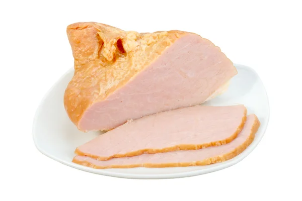 Нарізане м'ясо на білій тарілці — стокове фото