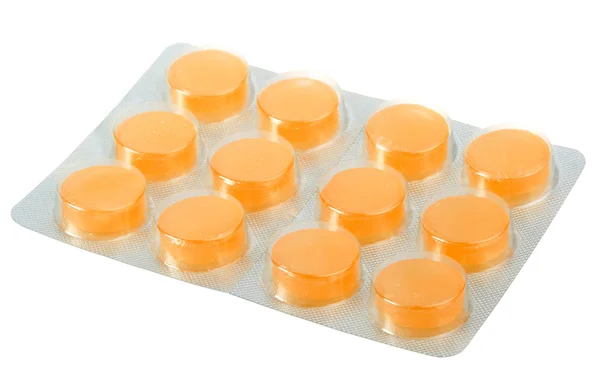 Oranžové pilulky v kovové blistr — Stock fotografie