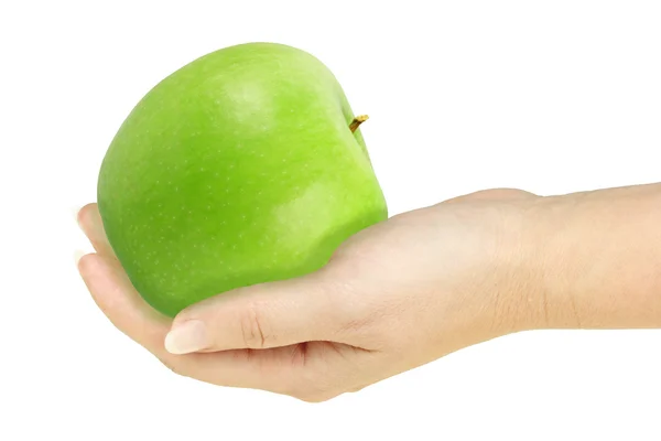 Manzana verde en una mano de mujer — Foto de Stock