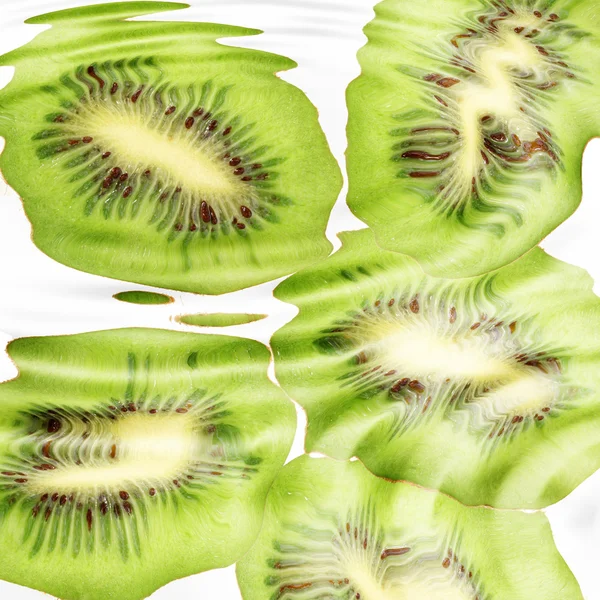 Group of cross a kiwi-fruits under water — Stock Photo, Image