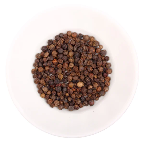 stock image Heap of black pepper on white plate