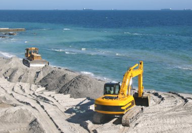 Excavator and bulldozer