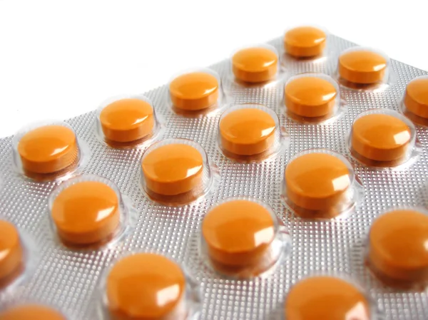 Pack of orange pills — Stock Photo, Image