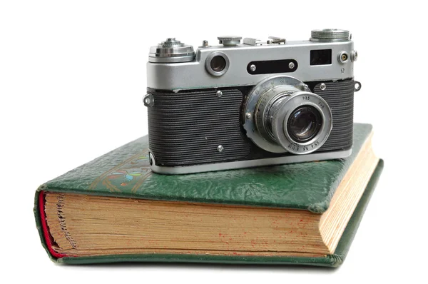 Фотоальбом и камера — стоковое фото