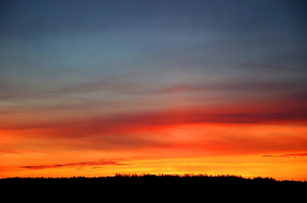 Żywe pomarańczowy zachód słońca — Zdjęcie stockowe