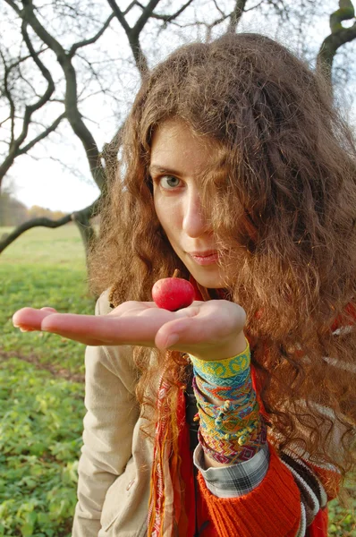 Woman holding an apple — Stock Photo, Image