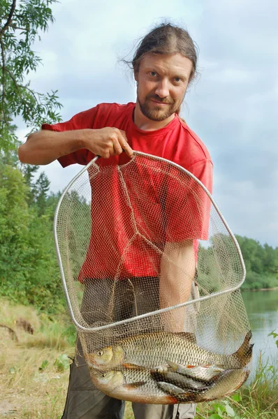 漁師と魚 — ストック写真