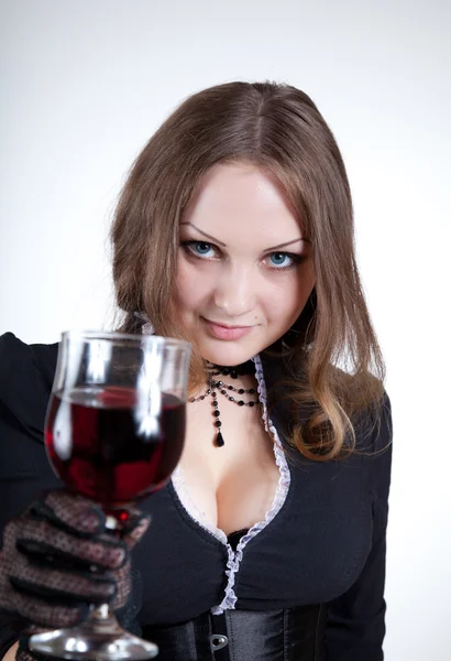 Sensual blue-eyed woman with glass of wine — Stock Photo, Image