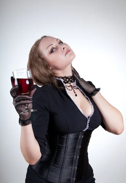 Sexy young woman with glass of red wine — Stock Photo, Image