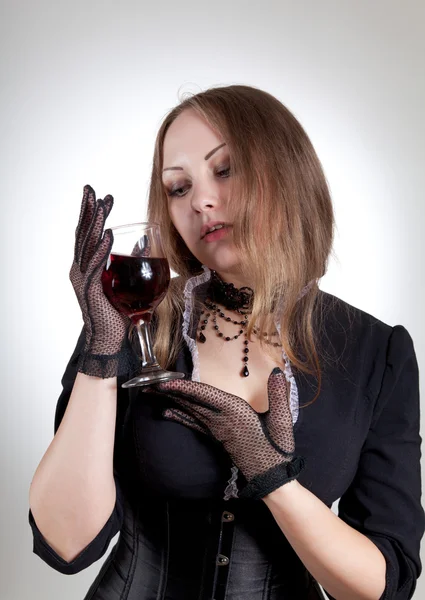 Romantic woman with glass of wine — Stockfoto