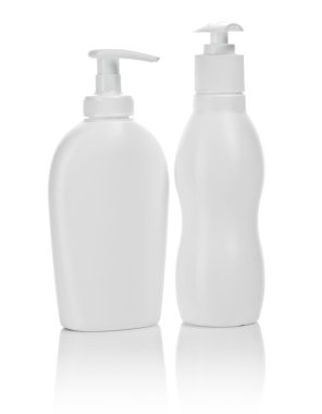 Two white cosmetical bottles isolated clipart