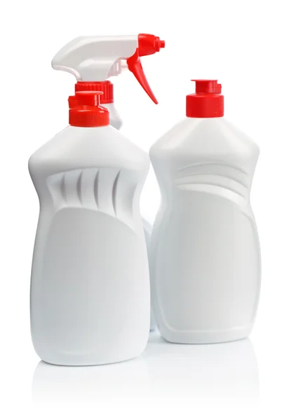 Två vita kök flaskor och vit spray med rött handtag — Stockfoto