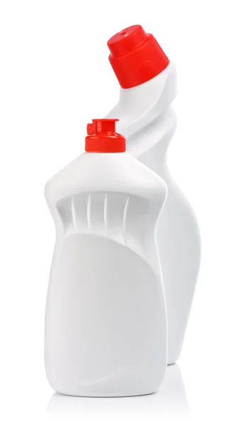 Белые бутылки с красной крышкой — стоковое фото