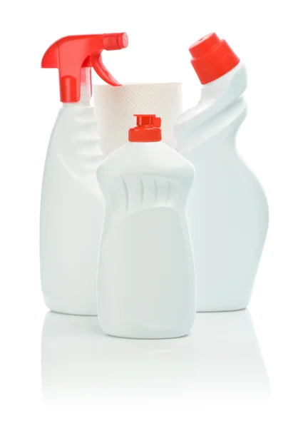 Tres botellas blancas con cubierta roja y toalla — Foto de Stock