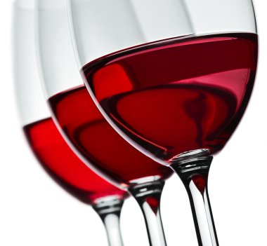 Section of three wineglas with red wine isolated clipart