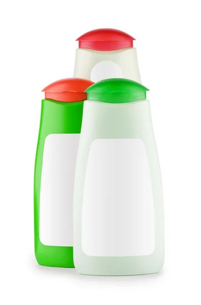Trzy butelki szamponu na białym tle — Zdjęcie stockowe