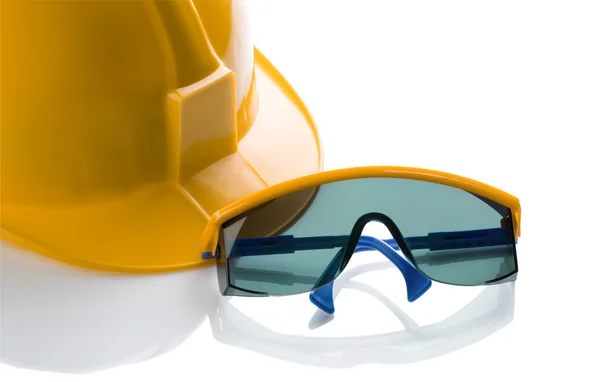 Yellow helmet and blue safety glases — Stock Photo, Image