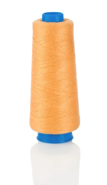 Orange tråd på blå spole — Stockfoto