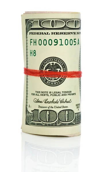 Roll dollars met rode tekenreeks — Stockfoto
