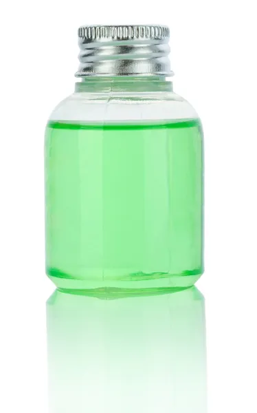 Transparent plastical bottle with green liquid — Stock Photo, Image