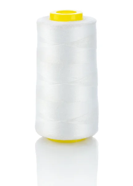 White thread on yellow spool — Stock Photo, Image