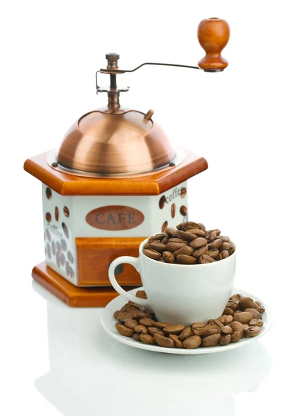 Composition of manual coffee grinder and cup with beans — Stock Photo, Image