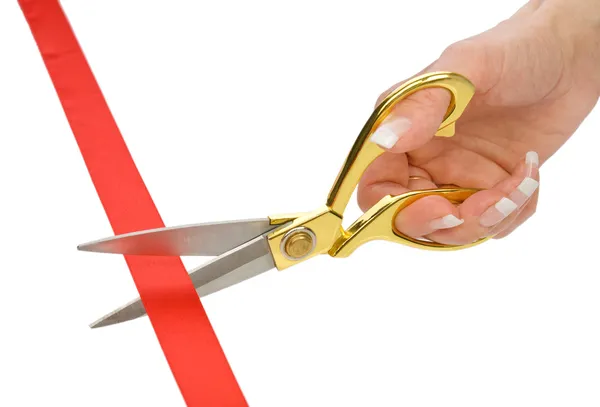 Single female hand with Scissors and red tape — Stock Photo, Image