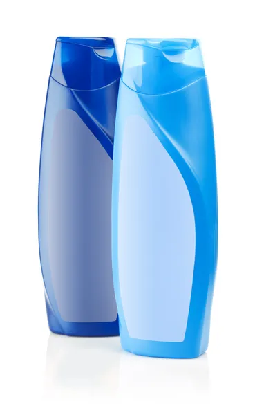 Blauwe flessen van shampoo — Stockfoto