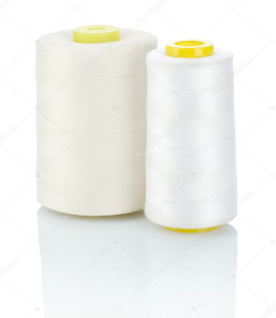 Two spool of white thread
