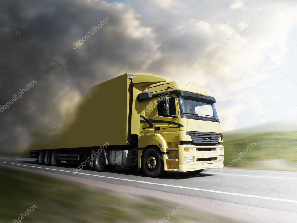 Truck speeding on highway to the light