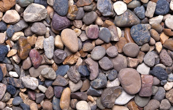 Bakgrund från flerfärgade stenar — Stockfoto