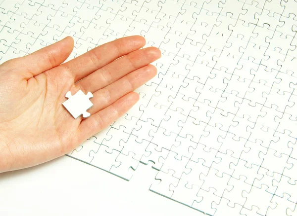 Hands holding puzzle — Stock Photo, Image