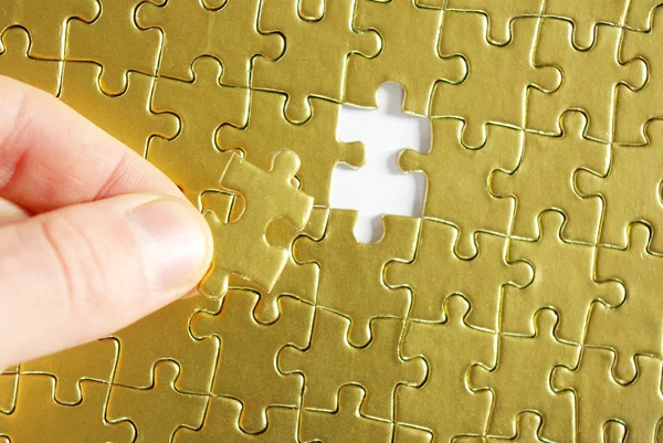 Ruce držící puzzle — Stock fotografie