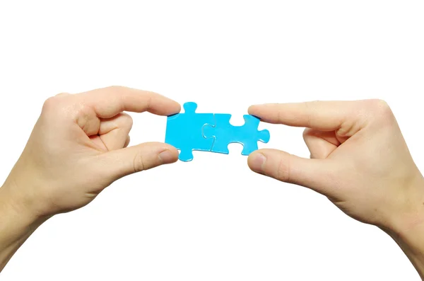 Puzzle in hands — Stock Photo, Image
