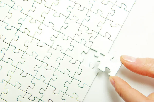 Hands holding a puzzle — Stock Photo, Image