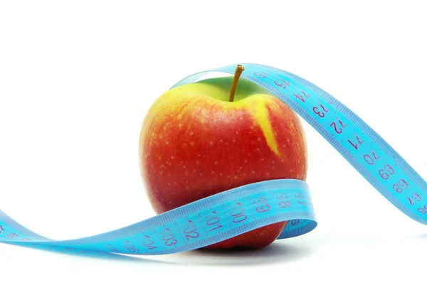 Яблуко і вимірювальна стрічка — стокове фото