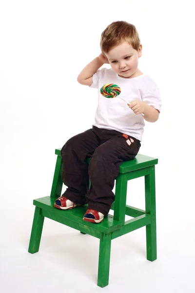 Chlapec s lízátko — Stock fotografie