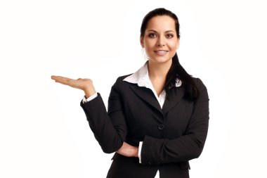 A young beautiful business woman pointing at copyspace clipart