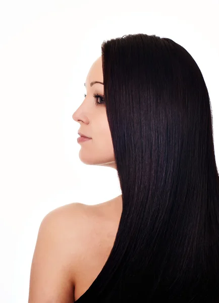 Jonge vrouw met weelderige gezonde lange haren — Stockfoto