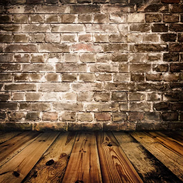 Grunge parede de tijolo e piso de madeira — Fotografia de Stock