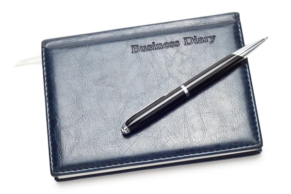 Бізнес щоденник з ручкою ізольовано над білим — стокове фото