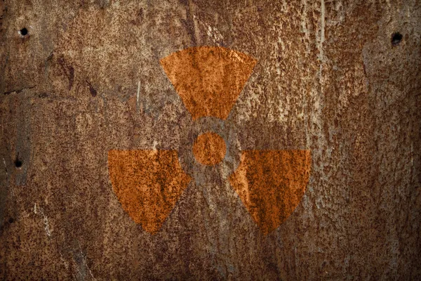 Nuclear radiation sign on rusty metal texture — Stock Photo, Image