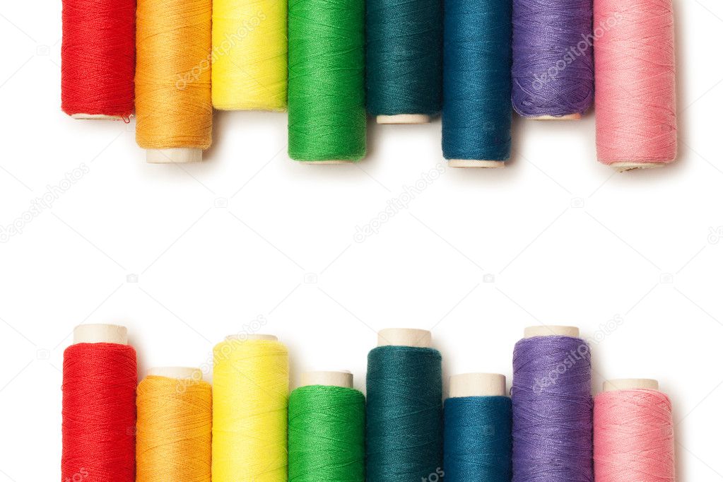Rainbow colored threads set isolated over white background